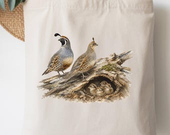 May include: A beige canvas tote bag featuring a detailed illustration of two adult California quail standing on a weathered log, with several small chicks nestled in a hollow opening within the wood, rendered in natural brown, gray, and tan tones.