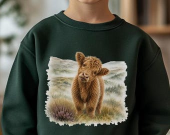 May include: A dark green long-sleeve sweatshirt featuring a rectangular graphic print of a brown Highland cow standing in a grassy field. The sweatshirt has a crew neckline, ribbed cuffs, and a ribbed hem, paired with blue denim jeans.