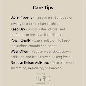 May include: A beige card with black text detailing jewellery care tips. The text includes instructions on storing, keeping dry, polishing, wearing, and removing jewellery before activities. The Silveristic Handmade Jewellery logo is at the bottom.