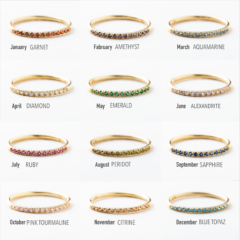 May include: Twelve gold rings with different colored gemstones, each representing a different month of the year. January: Garnet, February: Amethyst, March: Aquamarine, April: Diamond, May: Emerald, June: Alexandrite, July: Ruby, August: Peridot, September: Sapphire, October: Pink Tourmaline, November: Citrine, December: Blue Topaz.