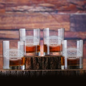 May include: Four clear glass tumblers with engraved quotes. Each tumbler has a different quote and the name of the person who said it. The quotes are: "The tenderness of a  rare steak is a matter of  whiskey and a lot of  time the rare steak is  the rare deal" - Johnny Carson, "Carry a flask of anything in case of  shared  celebrations and  a girlfriend who  is barely there" - W.C. Fields, "Safety & pleasure of  life is greatly  enhanced by  good  companionship and  a good cigar" - W.C. Fields, "I care not what brand of  liquor you drink, so long as  you drink it in moderation,  send a barrel of  it to my other generals" - Abraham Lincoln.
