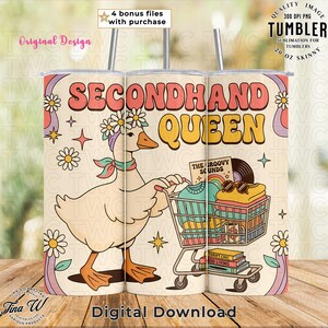 May include: A 20 oz skinny tumbler featuring a cartoon goose pushing a shopping cart filled with vintage items. The tumbler has the words "SECONDHAND QUEEN" in a retro font. Additional text includes "THE GROOVY SOUNDS" and "THRIFT CHIC GOOD LIVING".