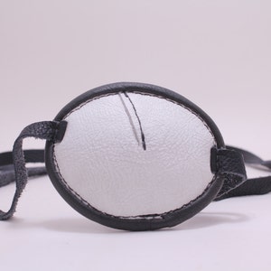 Black and white leather eye patch