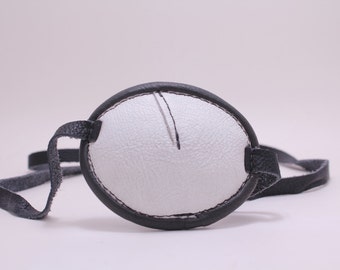 Black and white leather eye patch