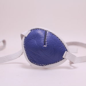 Blue and white leather eye patch