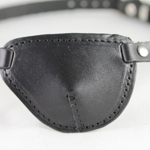 Contoured Eyepatch w/ buckle. Slim black eye patch