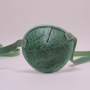 Green leather eye patch