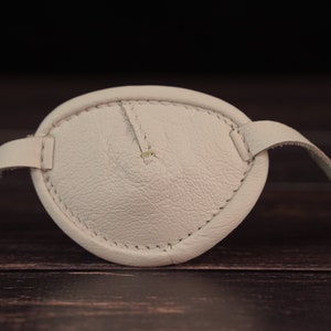 White leather eye patch