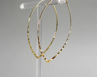 Elegant hammered gilded hoop earrings