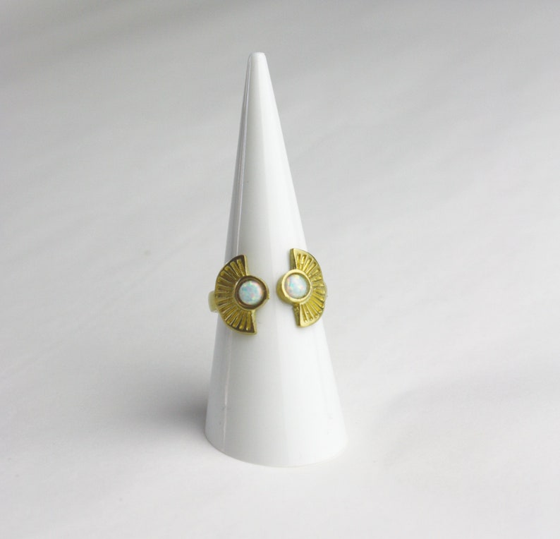 Ornament brass ring with small white opal stones