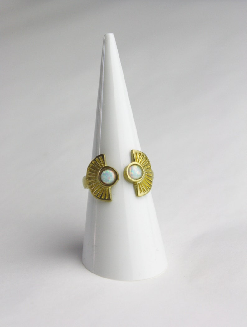 Ornament brass ring with small white opal stones