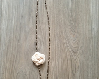 Necklace with crochet flower.