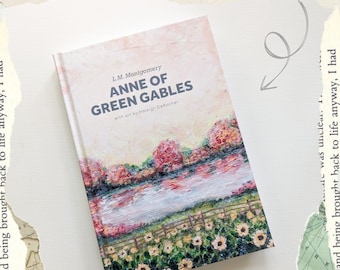 May include: Illustrated edition of Anne of Green Gables by L.M. Montgomery with art by Haleigh DeRocher. The cover features a painting of a lake with a field of sunflowers in the foreground.