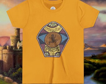 May include: Mustard yellow t-shirt featuring a graphic of a Chocolate Frog candy label. The label includes the text "Honeydukes" at the top, a brown frog illustration, and "Chocolate Frog" at the bottom. The shirt has a crew neck.