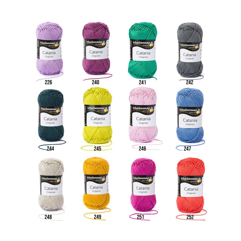 May include: A collection of 10 balls of yarn in various colours, including purple, green, grey, teal, yellow, pink, blue, beige, gold, and magenta. Each ball is labelled "Schachenmayr Catania Originals" with a corresponding number.
