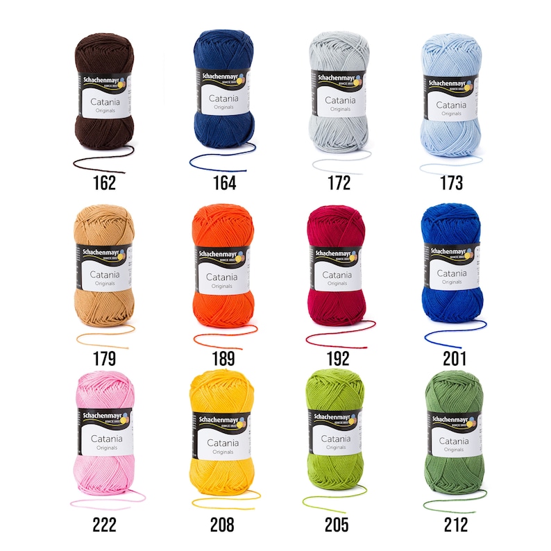May include: Assortment of 10 balls of Catania yarn in various colours, including brown, blue, light blue, orange, red, dark blue, pink, yellow, green, and olive green. Each ball has a label with the brand name "Schachenmayr" and the yarn name "Catania".