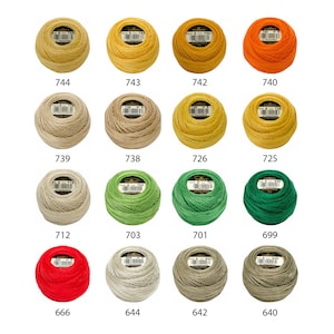May include: A collection of 12 spools of DMC embroidery floss in various colors, including red, orange, yellow, green, beige, and white. Each spool is labeled with a number.