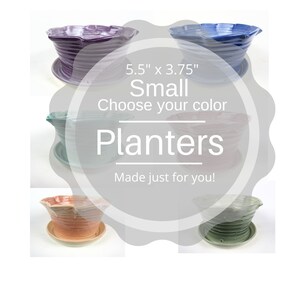 May include: Set of five small ceramic planters, each measuring 5.5 inches by 3.75 inches. The planters are available in a variety of colors, including purple, blue, green, pink, and orange. The planters are made with a striped design and have a matching saucer.