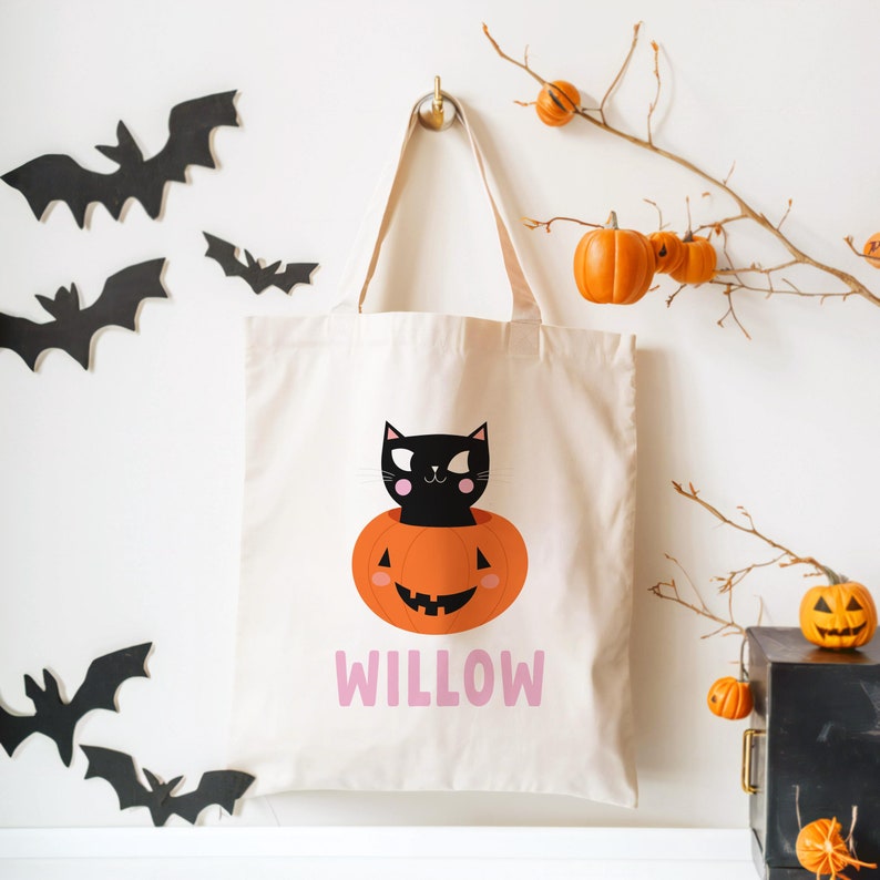 halloween candy tote bag for kids customized with name and a cute black cat in a pumpkin