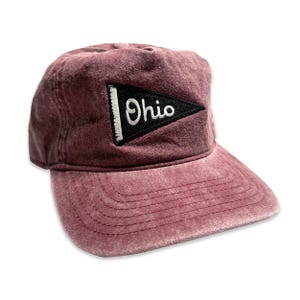 May include: A burgundy baseball cap with a black and white felt patch that says "Ohio" in a pennant shape.