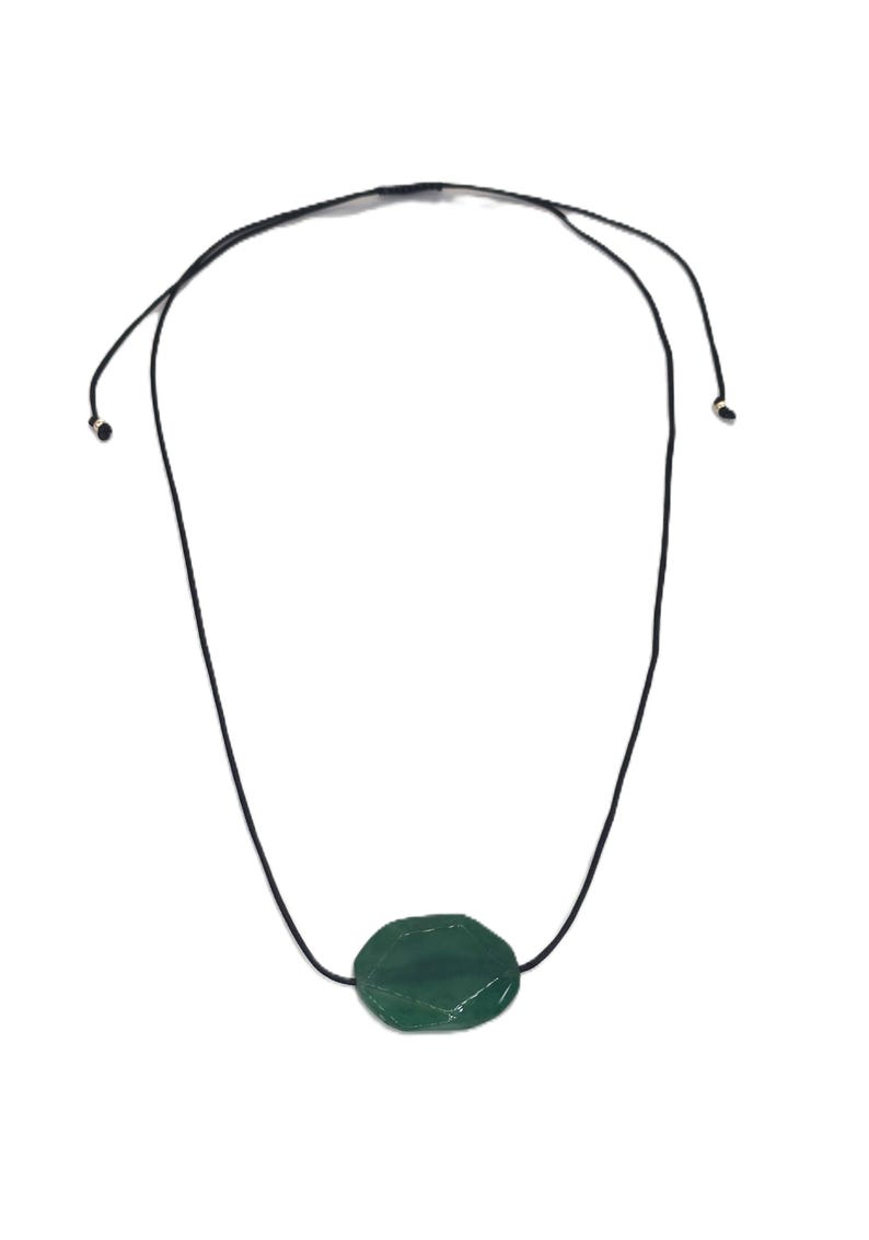 May include: A necklace featuring a dark green, oval-shaped gemstone pendant. The pendant is suspended from a black cord that can be adjusted for length. The gemstone has a faceted surface, catching the light. The necklace is displayed against a white background.
