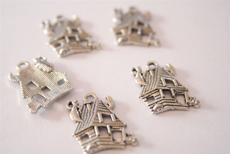 ref:2322 20 antique silver charms. .