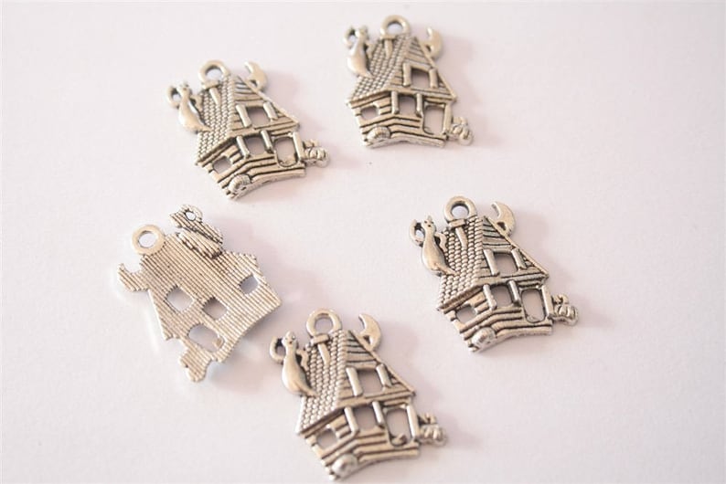 ref:2322 20 antique silver charms. .