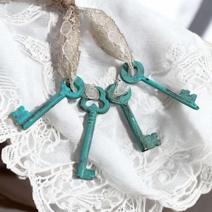 4 Skeleton Keys- Distressed Cast Iron decorative replica keys on vintage lace 2.75&quot; T4