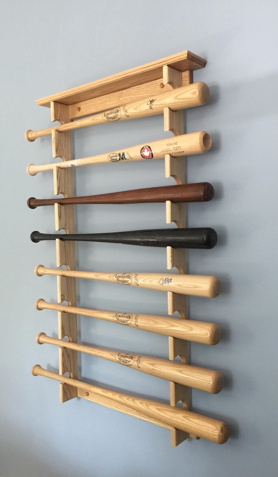 Horizontal display rack for 8 full sized baseball bats with trophy or ball shelf