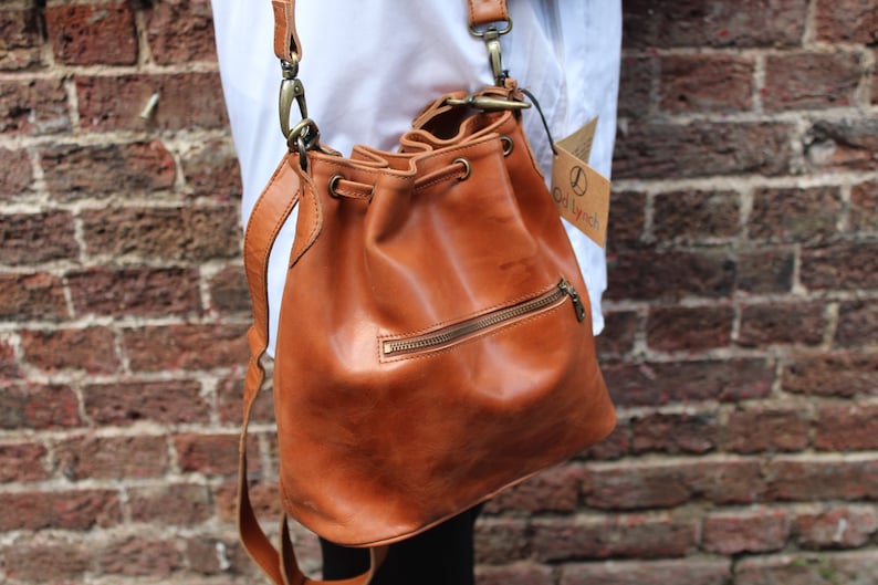 Bucket bag tan leather, Front zip pocket, Shoulder or chest strap, Cross body strap, Inner compartments, Soft leather, Drawstring top purse image 5