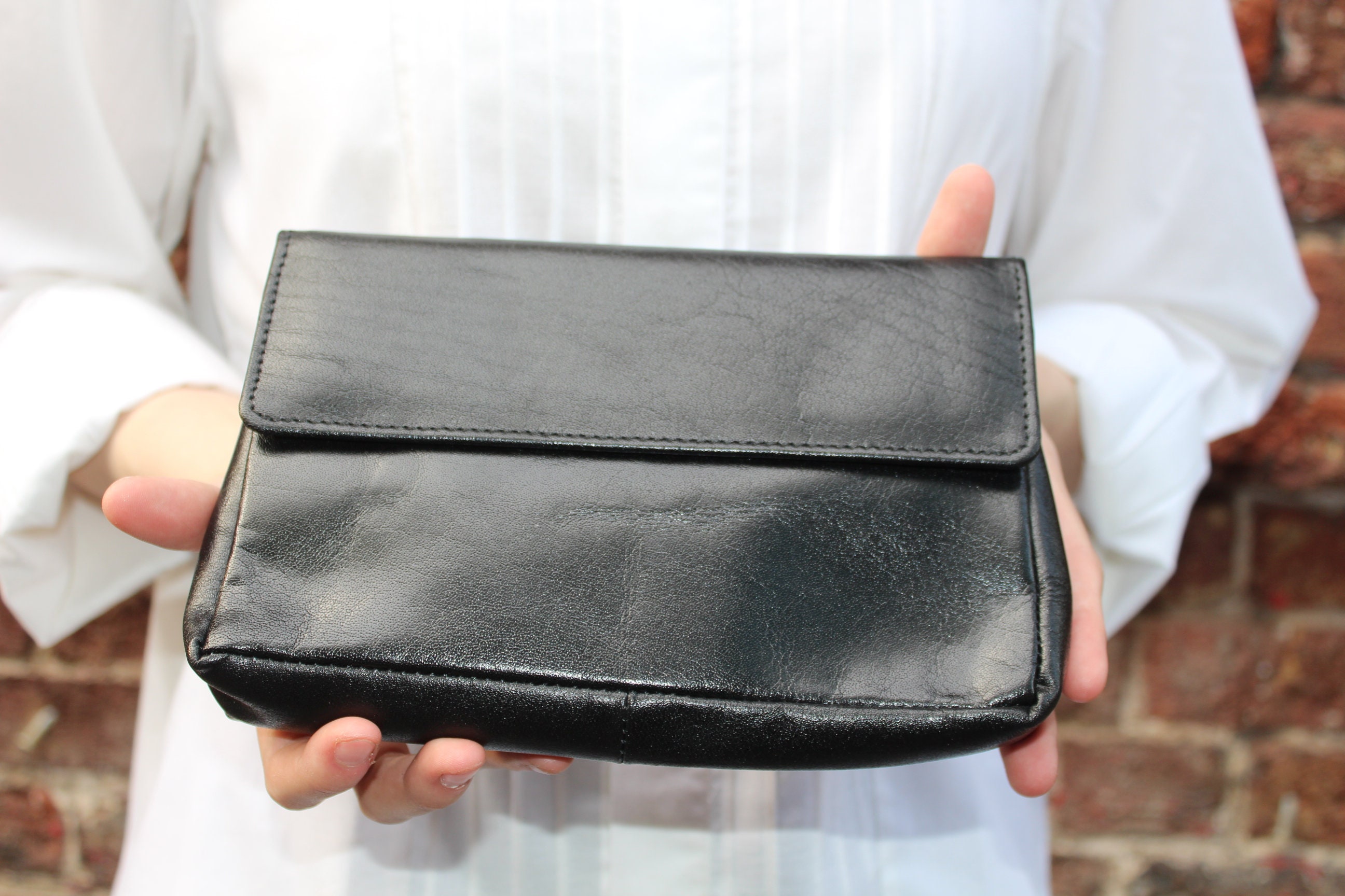 Soft black leather clutch bag hotsell