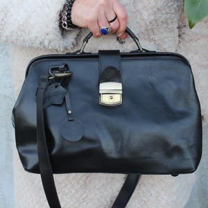 Black Doctor bag,Medical purse black leather,Medicine bag push lock close,Black shiny tough leather, Inside pockets,Long detachable strap,Ed