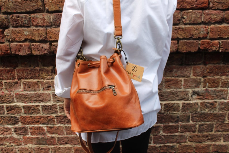 Bucket bag tan leather, Front zip pocket, Shoulder or chest strap, Cross body strap, Inner compartments, Soft leather, Drawstring top purse image 6