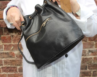 Bucket bag black leather, Drawstring handbag, Cross body and shoulder, Front pocket, Internal compartments, Medium size, Lightweight purse
