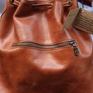 Bucket bag tan leather, Front zip pocket, Shoulder or chest strap, Cross body strap, Inner compartments, Soft leather, Drawstring top purse image 2