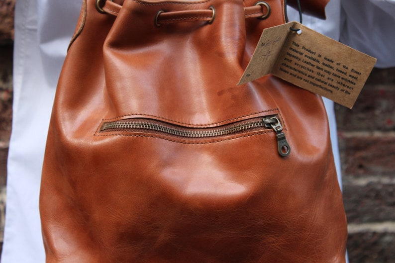 Bucket bag tan leather, Front zip pocket, Shoulder or chest strap, Cross body strap, Inner compartments, Soft leather, Drawstring top purse image 2