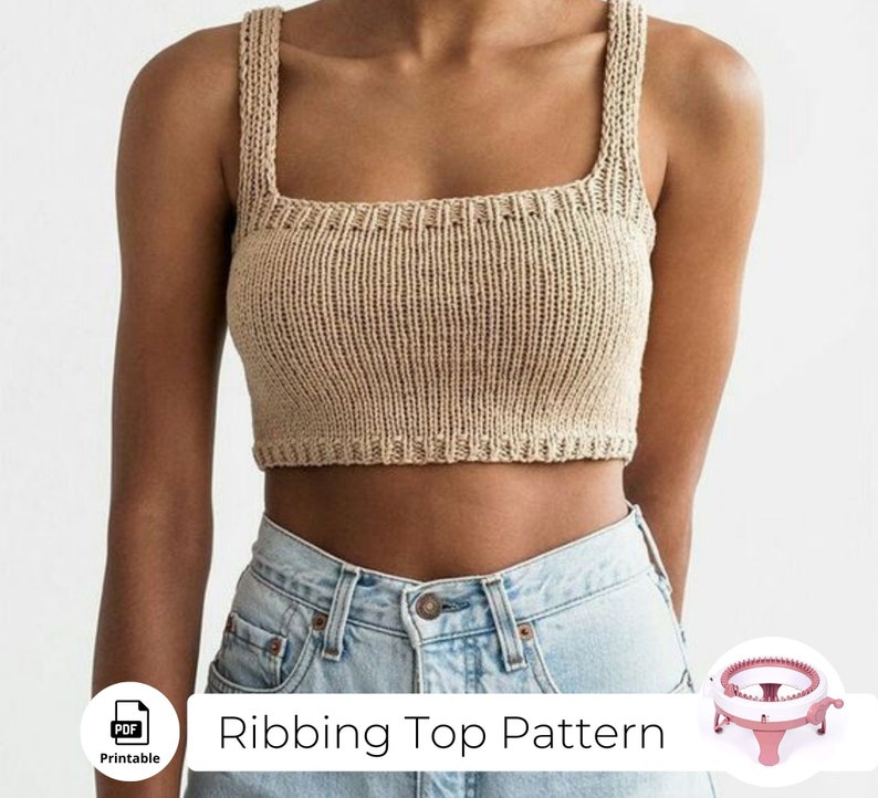 May include: A printable PDF pattern for a knitted ribbed crop top. The pattern is shown on a model wearing the top with blue jeans. The image also includes a pink knitting loom.
