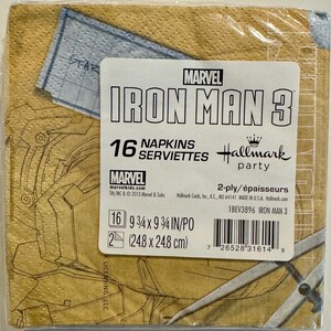 May include: A package of 16 napkins featuring Iron Man 3 from Marvel. The napkins are 9 3/4 inches by 9 3/4 inches and are 2-ply. The package is yellow with a red and black Iron Man design. The text "MARVEL IRON MAN 3" is printed in red and black on the package. The text "16 NAPKINS SERVIETTES" is printed in black on the package. The text "Hallmark party" is printed in black on the package. The text "2-ply/&eacute;paisseurs" is printed in black on the package. The text "1BEV3896 IRON MAN 3" is printed in black on the package.