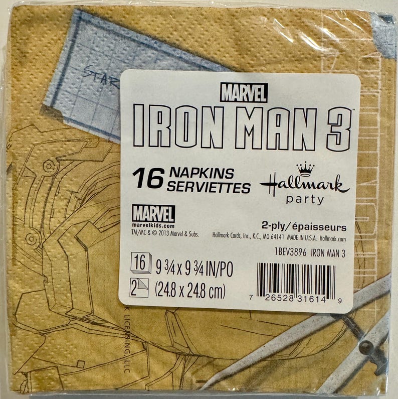May include: A package of 16 napkins featuring Iron Man 3 from Marvel. The napkins are 9 3/4 inches by 9 3/4 inches and are 2-ply. The package is yellow with a red and black Iron Man design. The text "MARVEL IRON MAN 3" is printed in red and black on the package. The text "16 NAPKINS SERVIETTES" is printed in black on the package. The text "Hallmark party" is printed in black on the package. The text "2-ply/&eacute;paisseurs" is printed in black on the package. The text "1BEV3896 IRON MAN 3" is printed in black on the package.