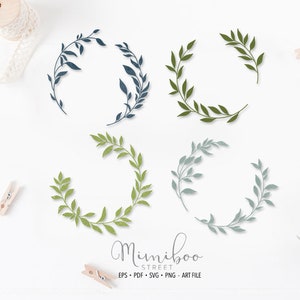 Pode incluir: Conjunto de seis ilustrações digitais de coroas de flores, em diferentes tons de verde e azul. As coroas são feitas de folhas e ramos estilizados simples. O texto "Mimiboo Street" está na parte inferior da imagem.