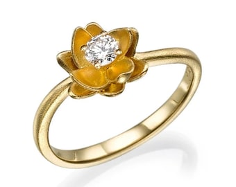 May include: A gold ring with a flower design featuring a single diamond in the center.