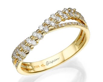 May include: A gold band ring with a criss-cross design featuring a row of small diamonds on each band. The ring is engraved with the word "Gispan".