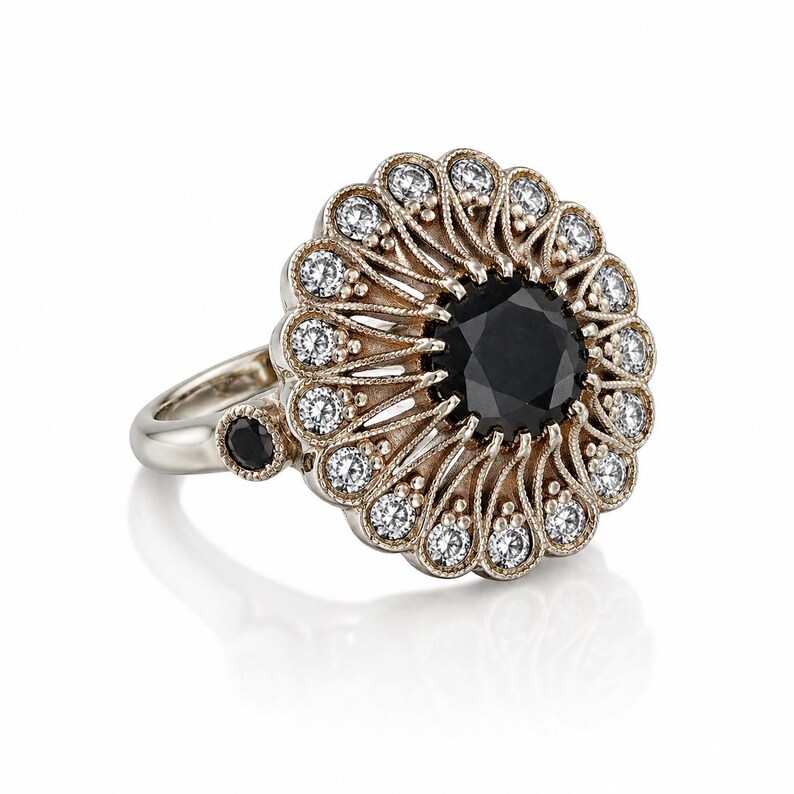 May include: A detailed, ornate ring featuring a large, round black gemstone at the center, surrounded by smaller white gemstones. The ring has a gold-toned setting with intricate filigree details and a silver band. A smaller black gemstone is set on the side.