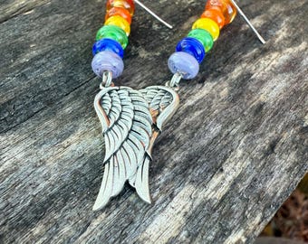 May include: Rainbow coloured glass bead earrings with silver angel wing charms.