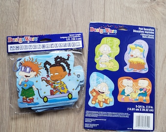 May include: A blue and white banner with the words "Happy Birthday" printed on it. The banner is decorated with images of the characters from the Rugrats cartoon. The banner is 5 feet long and comes with 4 different designs of the Rugrats characters.