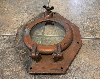 Ojo de buey antiguo de barco, hierro macizo con tuerca de mariposa, ventana de cristal, decoración náutica.