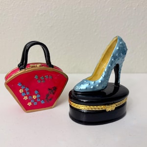 May include: A set of three ceramic mugs with a speckled, matte finish. The mugs are in shades of cream, light gray, and dark gray. Each mug has a simple, minimalist design and a rounded handle. The mugs are stacked on top of each other.