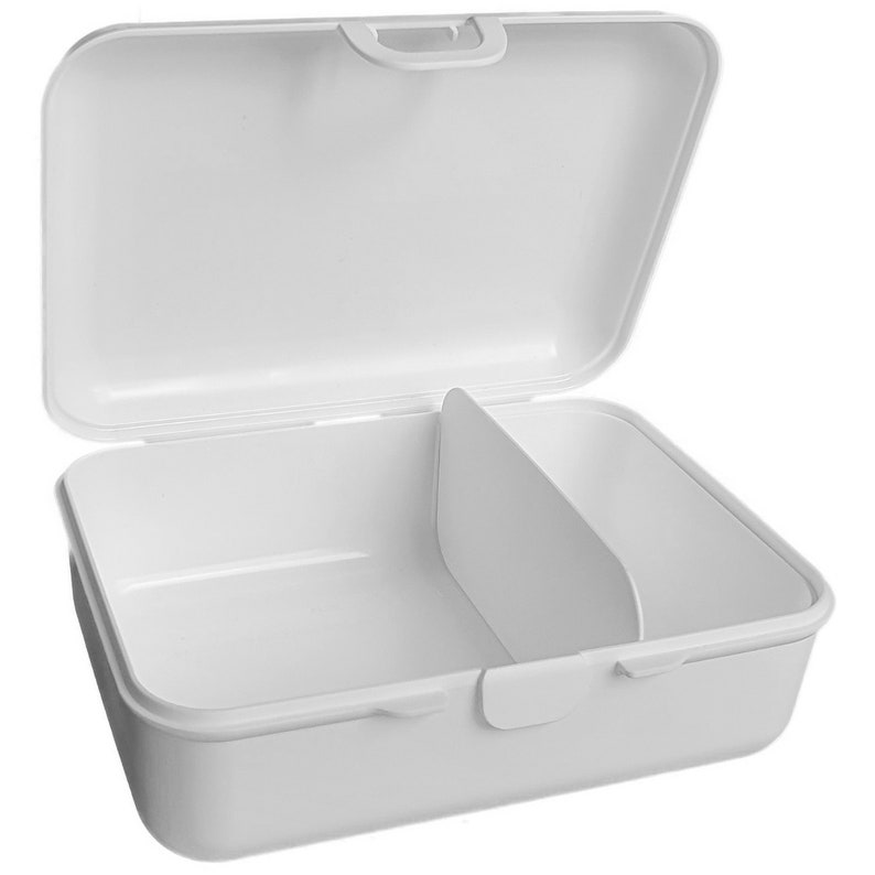 May include: White plastic lunch box with a hinged lid and a removable divider. The lunch box has a handle on the top.