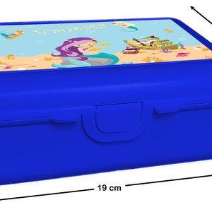 May include: Blue plastic lunchbox with a mermaid and ship design. The lid features a personalized name "Vanessa". The lunchbox measures 7 inches tall, 13.9 inches wide, and 19 inches long.