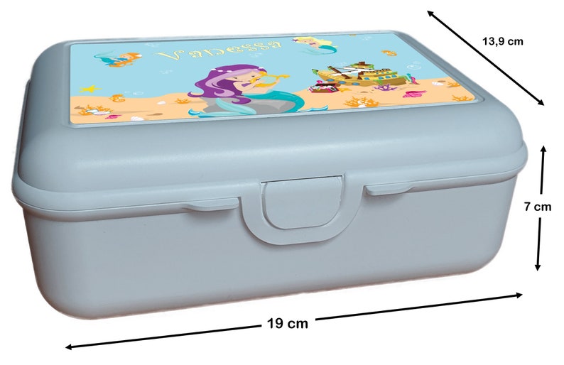 May include: A light blue lunchbox with a mermaid design. The lid features a mermaid with purple hair and a seashell, a ship, and the name "Vanessa". The lunchbox measures 7 inches tall, 13.9 inches wide, and 19 inches long.
